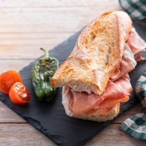 Spanish,Serrano,Ham,Sandwich,On,Wooden,Table.,Spanish,Bocadillo,De