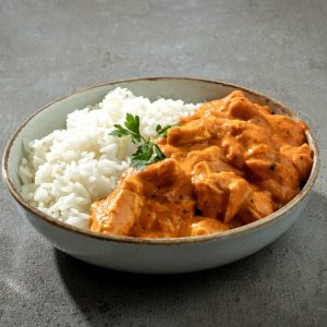 Bowl,Of,Chicken,Tikka,Masala,With,Rice,On,Dark,Grey