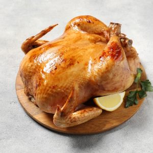 Tasty,Roasted,Chicken,With,Parsley,And,Lemon,On,Light,Grey